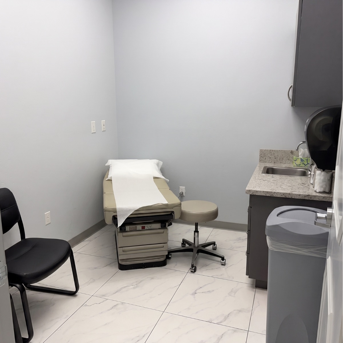 Exam room with treatment table at the Coffee Road clinic